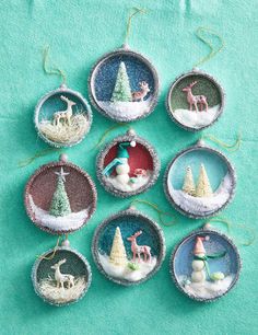 christmas ornaments are arranged in the shape of snow globes