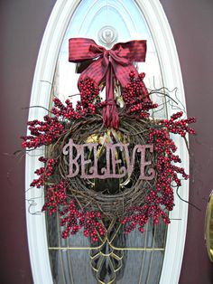 a wreath with the word believe on it