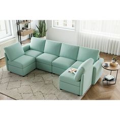 a living room with a blue sectional couch