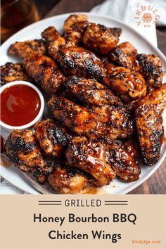 grilled honey bourbon bbq chicken wings on a white plate