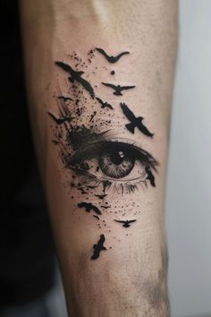 a man's leg with birds flying around it and an eye in the center