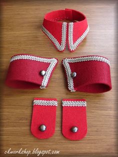 four pieces of red fabric with silver beads on them and two pairs of matching wristbands