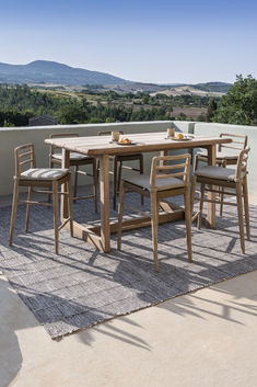 Outdoor bar dining set on a terrace including a bar height table and counter height bar stools Designer Bar Stools, Counter Height Bar, Counter Height Bar Stools, Stool Design, Counter Height Stools, Outdoor Bar, Counter Height, Bar Set, Bar Chairs