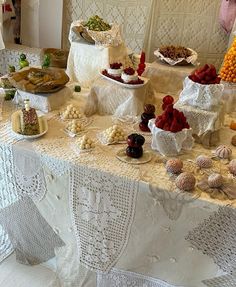 a table covered in lots of different types of foods and desserts on it's sides