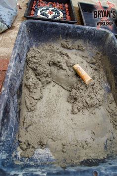 a sand pit with a baseball bat in it