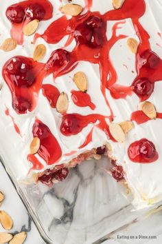 a dessert with almonds and cherries on top