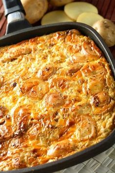 the casserole is ready to be cooked in the oven with potatoes on the side