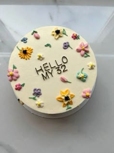 a cake decorated with flowers and the words hello my 3 / 4 written on it