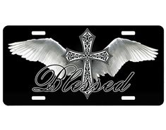 a black and white license plate with an angel cross