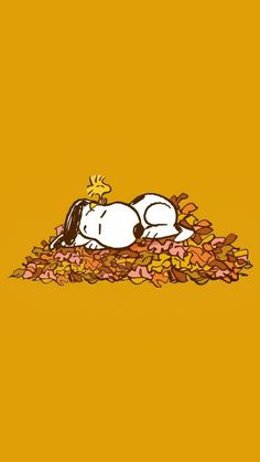 a cartoon dog laying on top of a pile of leaves