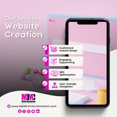 a cell phone with the words website creation on it and an image of a laptop