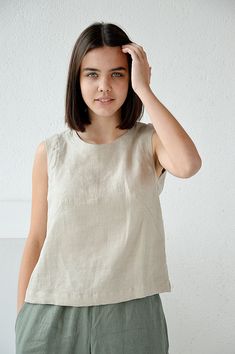 "Natural sleeveless linen top. Handmade linen basic tank top. Choose size: XS Bust 82 - 84 cm. ( 32 1/4\" - 33\") Waist 66 - 68 cm. / (26\" - 26 3/4\") Hips 90 - 92 cm. / (35 1/2\" - 36 1/4\") S Bust 86 - 88 cm. ( 33 3/4\" - 34 3/4\") Waist 70 - 72 cm. / (27 3/4\" - 28 1/4\") Hips 94 - 96 cm. / (37\" - 37 3/4\") M Bust 90 - 92 cm. ( 35 1/2\" - 36 1/4\") Waist 74 - 76cm. / (29 1/4\" - 30\") Hips 98 - 100 cm. / (38 1/2\" - 39 1/4\") L Bust 94 - 96 cm. ( 37\" - 37 3/4\") Waist 78 - 80 cm. / (30 3/4 Fitted Linen Tank Top For Everyday, Sleeveless Linen Top For Everyday, Everyday Sleeveless Linen Top, Casual Linen Sleeveless Blouse Tank Top, Everyday Linen Tank Top, Casual Flax Linen Tank Top, Beige Linen Summer Tops, Everyday Linen Sleeveless Tank Top, Everyday Sleeveless Linen Tank Top