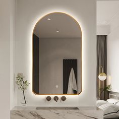 a bathroom with marble counter top and large mirror above the sink in front of it