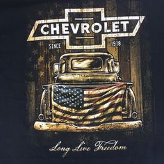 an old chevrolet truck with the american flag on it