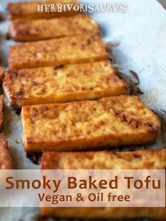 baked tofu sticks on parchment paper with text overlay that reads smoky baked tofu vegan & oil free