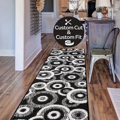 a black and white area rug with the words custom cut and custom fit on it