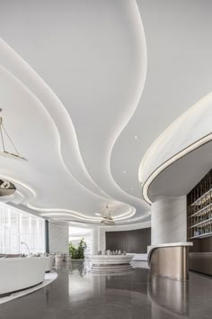 the interior of a modern restaurant with marble flooring and white walls, along with circular lighting fixtures