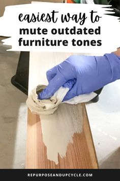 a person in blue gloves is painting a wooden table with white paint on it and the words, easy way to mutate outdated furniture tones