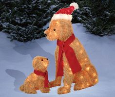 a teddy bear and its baby are sitting in the snow with christmas lights on them