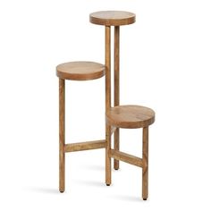 two wooden stools sitting next to each other