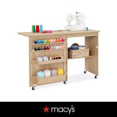 a sewing machine and some crafting supplies on a table with the words macy's written below it