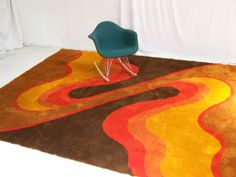 a chair sitting on top of a brown rug