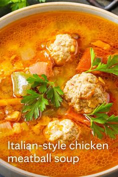 italian - style chicken meatball soup in a bowl with parsley garnish