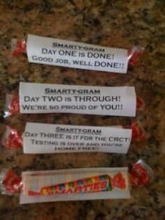 three candy bar wrappers sitting on top of a counter