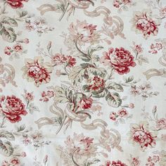 an old floral fabric with red and white flowers