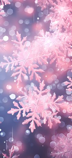 pink snowflakes are floating in the air