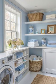 a washer and dryer in a room with blue walls