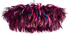 a purple feather chandelier hanging from a ceiling