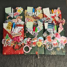 an assortment of paper and stickers on a bed