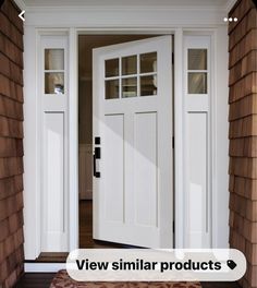 a white front door with two sidelights on the top and bottom panel, in an open house