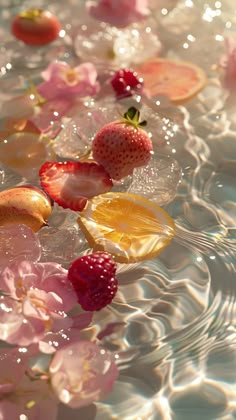 strawberries and peaches floating in water with bubbles