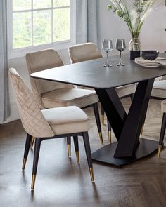 a dining room table with chairs around it