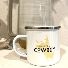 a white coffee mug sitting on top of a counter