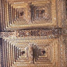 an old wooden door with intricate carvings on it