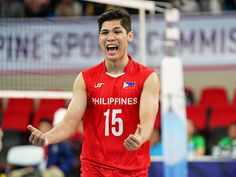 a male volleyball player in a red uniform is celebrating his team's victory over the philippines