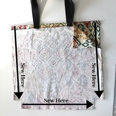 a bag hanging on a wall with two arrows pointing to the same fabric size as shown below