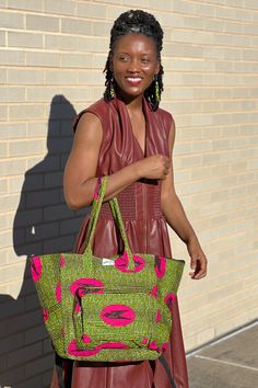 The bag that fits everything and is just everything! The Everything Bag fits all of your essentials stylishly. Handmade in Ghana from authentic Ankara. Disclaimer: Product color and quality seen may vary slightly compared to actual items due to photography lighting conditions and items being one-of-a-kind and cut from different parts of the fabric. Green Double Handle Travel Bag For On-the-go, Pink Handheld Hobo Bag For Travel, Casual Green Travel Bag With Removable Pouch, Green Tote Weekender Bag For On-the-go, Green Travel Shoulder Bag With Adjustable Strap, Green Tote Shoulder Bag For On-the-go, Everyday Green Shoulder Travel Bag, Green Rectangular Travel Bag With Removable Pouch, Green Tote Shoulder Bag For Travel