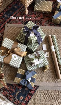 several wrapped presents sitting on top of a rug