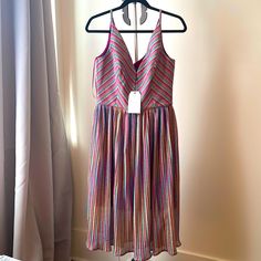 Multi-Color Fit And Flare Dress Deep V-Neck With A Scoop Back Pleated Midi Skirt Multicolor V-neck Lined Maxi Dress, Multicolor Lined V-neck Maxi Dress, Lined Multicolor V-neck Maxi Dress, Purple V-neck Sundress For The Beach, Purple V-neck Sundress For Spring, Purple V-neck Spring Sundress, Purple V-neck Beach Sundress, Lined Purple Midi Dress For Summer, Purple Lined Midi Dress For Summer