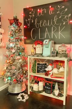 a decorated christmas tree in front of a chalkboard