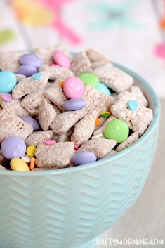 a blue bowl filled with cereal and candy