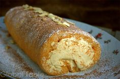 a piece of bread on a plate with powdered sugar and sprinkles