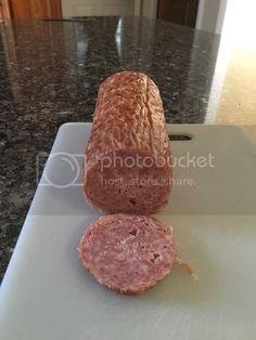 a large piece of meat sitting on top of a cutting board