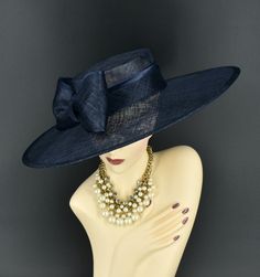 Note: The design of this hat, particularly the shallower crown, was crafted to create a unique aesthetic that suits some individuals perfectly. However, if you notice that the hat tends to slip, I would advise attaching an elastic strap to ensure a more secure and comfortable fit. ✿*.Key Features.*✿ This is a wide flat brim hat!! It's made of sinamay (3 layers ) and satin.  A nice sinamay bow is trimmed with satin ribbon too, very cool, one of my favorite hats! High quality. It's more beautiful in person! Great for Kentucky derby, weddings, church, Easter, Royal Ascot, horse races, cocktails, tea party, or any hat wearing occasion. Hat base size: From front to back: 19" (48cm) From left to right: 18.25" (46cm) Wide brim appr: 6" (15cm) Crown Depth: 3.5" (9cm) Hat girth: 21" (53.34cm). It f Luxury Blue Party Hat, Formal Wide Brim Boater Hat For Royal Ascot, Elegant Costume Hat With Curved Brim In Sinamay, Elegant High Crown Boater Hat For Kentucky Derby, Formal Brimmed Sinamay Hat, Evening Boater Hat With Short Brim In Sinamay, Formal Sinamay Brimmed Hat, Elegant High Crown Boater Hat For Races, Elegant High Crown Boater Hat For Formal Occasions