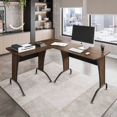 a desk with a computer on top of it in front of a window overlooking the city