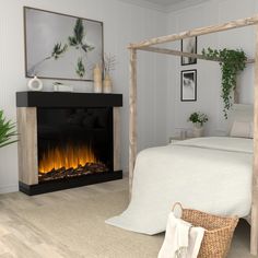 a bedroom with a bed, fireplace and pictures on the wall above it is shown